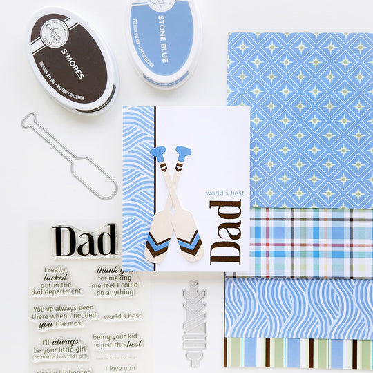 “World’s Best Dad” card with decorative paddles on wave-inspired patterned paper.