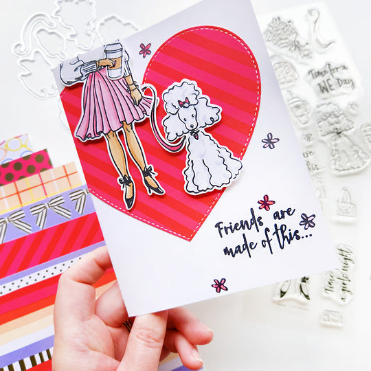 Girl walking her poodle over a heart card
