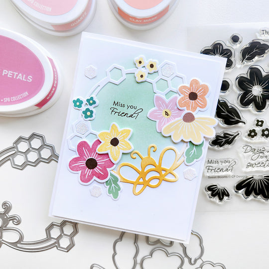 "Miss You Friend" card with a honeycomb wreath accented with flowers and a bee.
