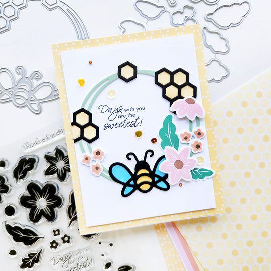 "Days with You Are the Sweetest" card with a honeycomb wreath, floral and bee accents, atop polka dot paper.