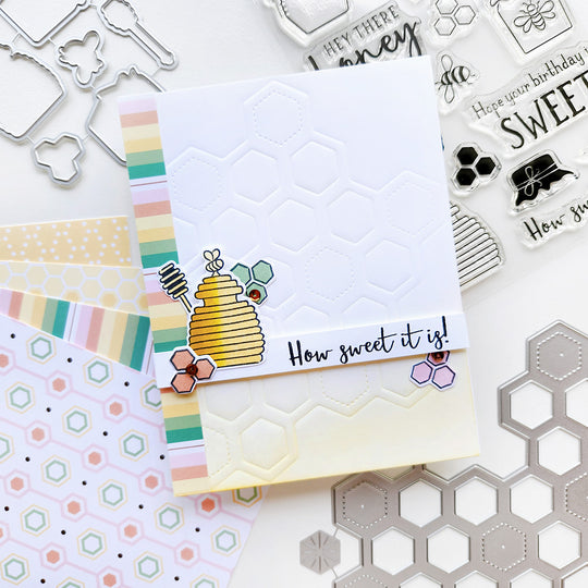 "How Sweet It Is" card with a honey pot atop honeycomb shapes and striped paper.