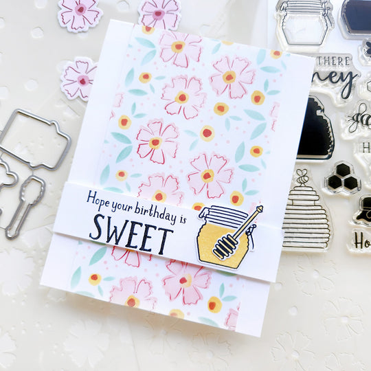 "Hope Your Birthday Is Sweet" card with a honey pot set on a floral backdrop.