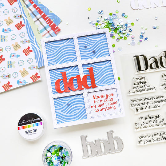 “Dad, thank you for making me feel like I could do anything” card with a wave-inspired paper background with sequin.