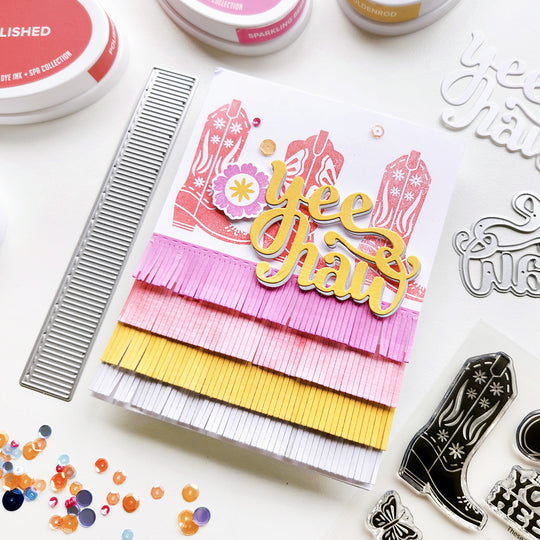 A card featuring floral and butterfly cowgirl boots, adorned with colorful fringe and the "Yeehaw" sentiment, a perfect western touch!