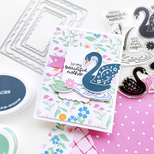 "To my beautiful mother" sentiment card featuring a graceful blue swan on a rippled lake, with a floral-patterned paper.