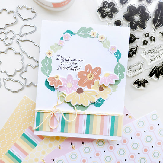"Days with you are the sweetest" card featuring a floral wreath, paired with striped paper.