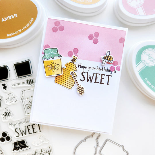 "Hope Your Birthday Is Sweet" card with honey pots and a bee atop honeycomb shapes.