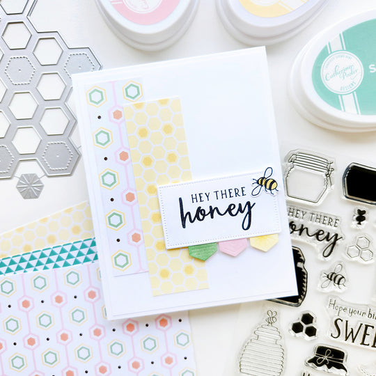 "Hey there Honey" card with a bee atop honeycomb-shaped patterned paper.