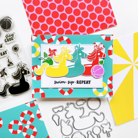 "Swim, Sip, Repeat" card featuring colorful unicorn floats and beach ball, 
set on life preserver–themed paper.
