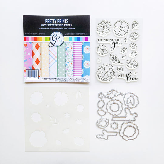 With Love Bundle Crafting supplies including patterned paper and metal dies.