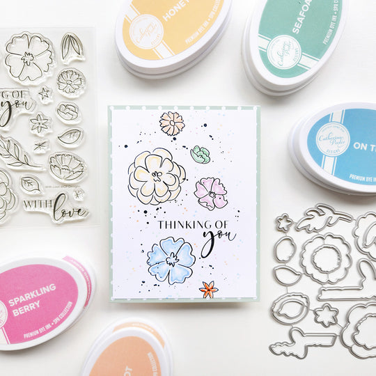 Think of you card with floral design and stamping tools on a white background