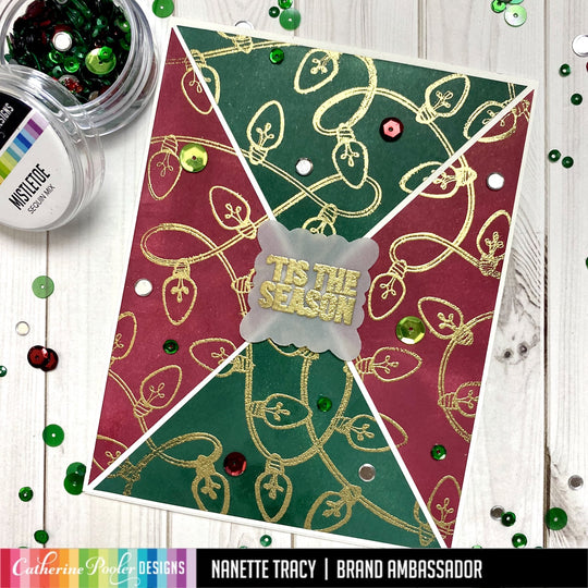 tis the season card with string lights background