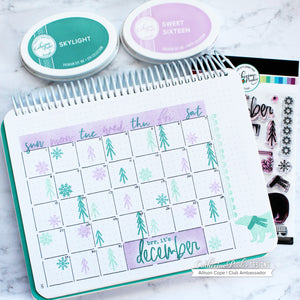 December monthly calendar with blue and purple pine trees and snowflakes