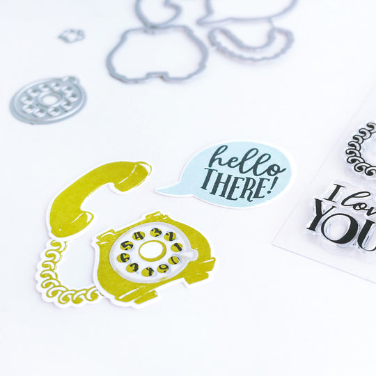 Green rotary phone and blue speech bubble