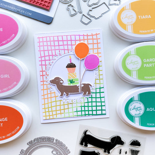 Doxie with Balloons & Cupcake over Rainbow Scribble Grid Background