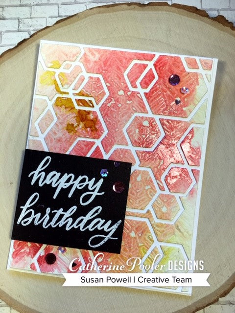 Happy birthday sentiment with red and yellow hexagon background