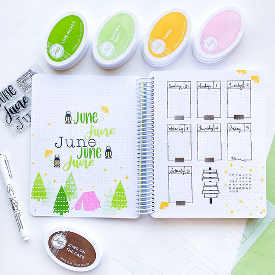 June Canvo cover spread with pine trees and tent