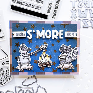 S'more kisses card using S'mores Please patterned paper, Happy Camper stamps and dies, Block Alphabet dies, Notes of Love Sentiments Stamp set and Sentiment Banner dies, Midnight and assorted ink pads.