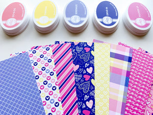 Happy Hearts Patterned Paper laid out with coordinating ink pads