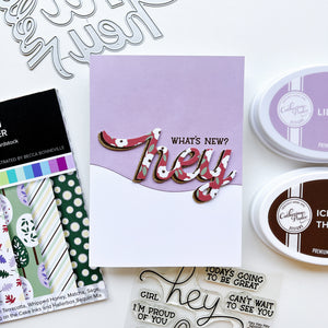 What's New card using Because Flowers patterned paper, Hello Trio Word dies, Hey, Hey, Hey Sentiments stamp set, Icing on the Cake and Lilac ink pads.