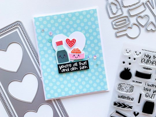 Sushi cutout pieces with White heart on blue polka dot paper