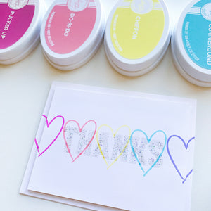Hip Hearts stamped in rainbow order with Thanks in glitter