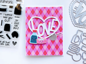 Love in Heart over pink argyle paper with sushi cutouts