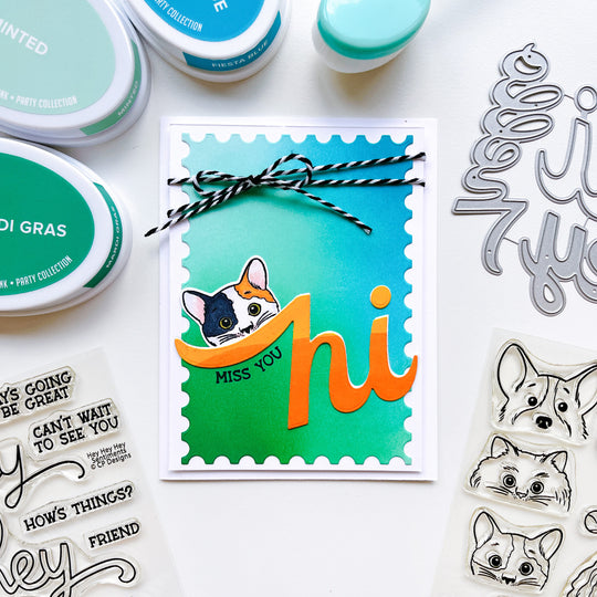 Miss you card using Hello Trio word dies, More Peeking Pets stamps and dies, Hey, Hey, Hey Sentiments stamps, Notecard Postage dies, twine, and Midnight, Mardi Gras, Minted, Fiesta Blue and other ink pads.