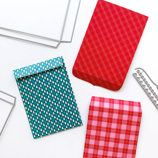three envelopes made with notecard envelope dies