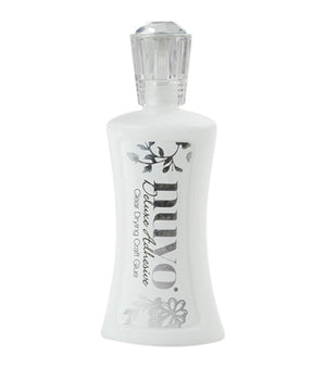 bottle of nuvo deluxe adhesive