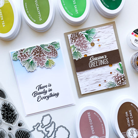 2 cards pinecone greetings layered on blended and birch paper backgrounds