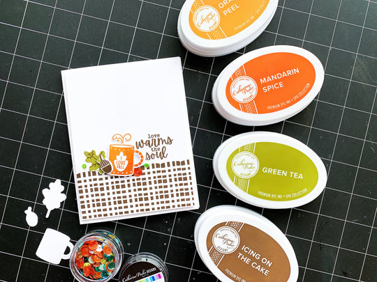 card with pumpkin season stamps next to coordinating ink pads