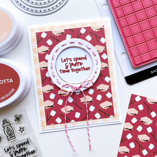 S'more time card using Cozy Plaid background stamp, S'mores Please patterned paper, Round About dies, Party Twist twine, Happy Camper stamps, Terracotta and Buttercream ink pads.and