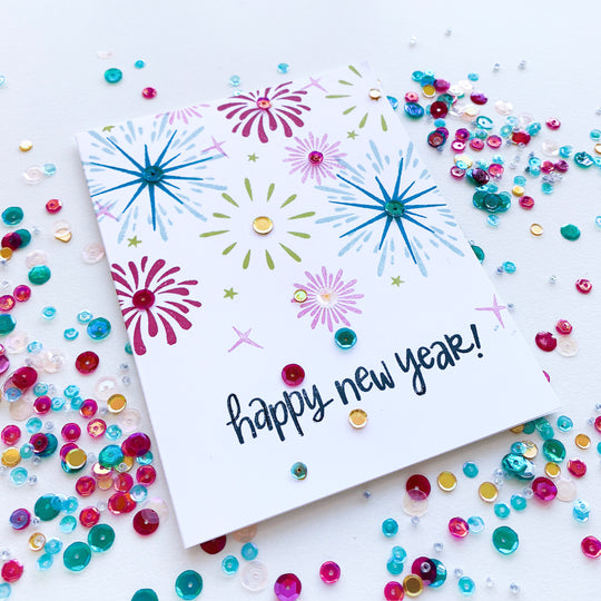 Sparkle and Pop Fireworks over Happy New Year