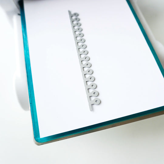 Spiral Notebook Border Die on white cardstock