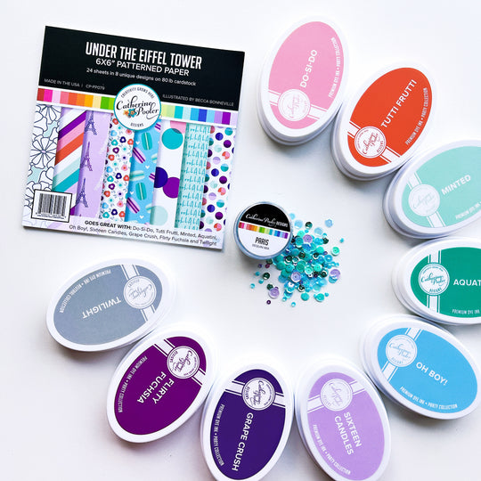 Under the Eiffel Tower Patterned Paper next to coordinating ink pads