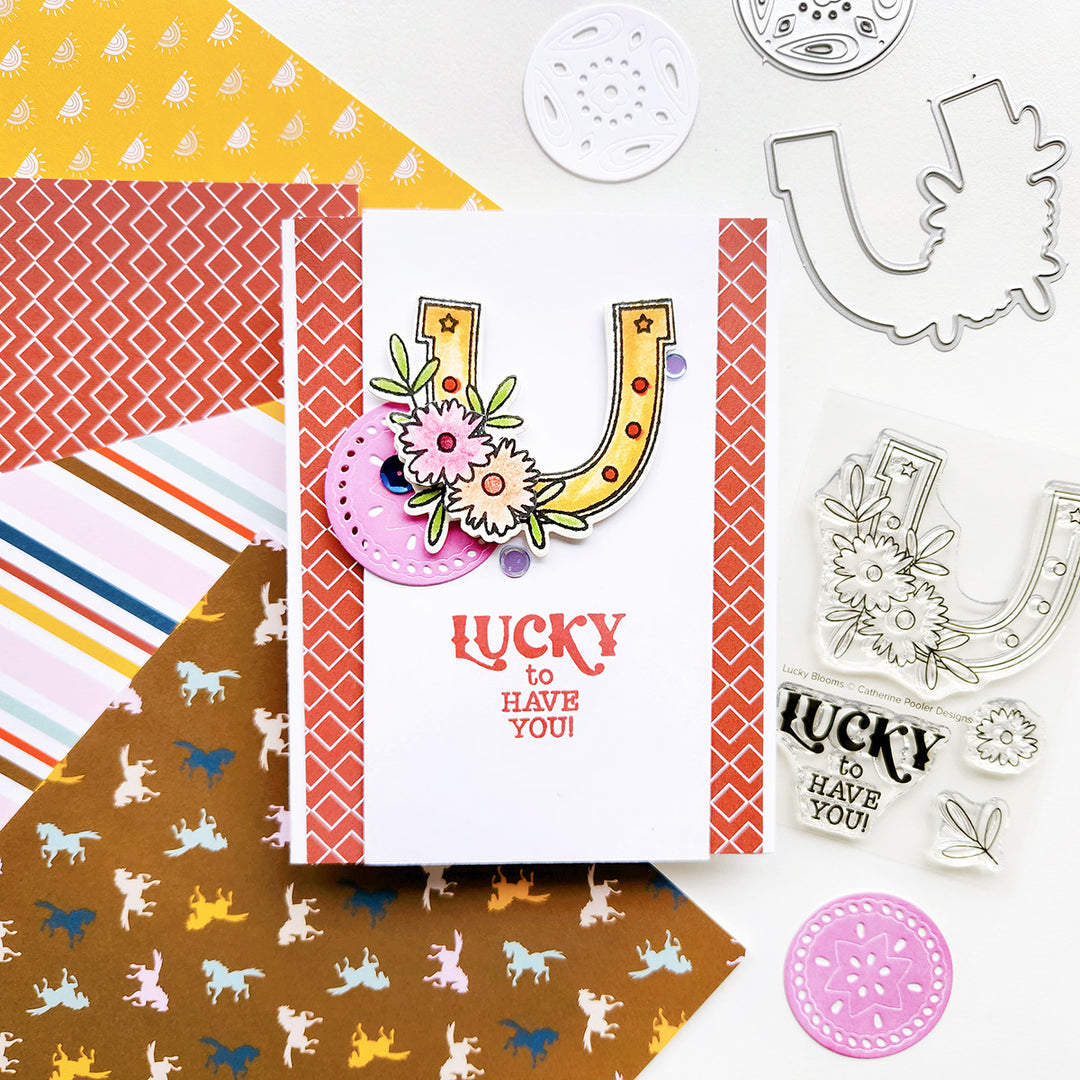 A card with the sentiment "Lucky to have you," featuring a horseshoe with floral accents, set against modern country-inspired patterned paper.