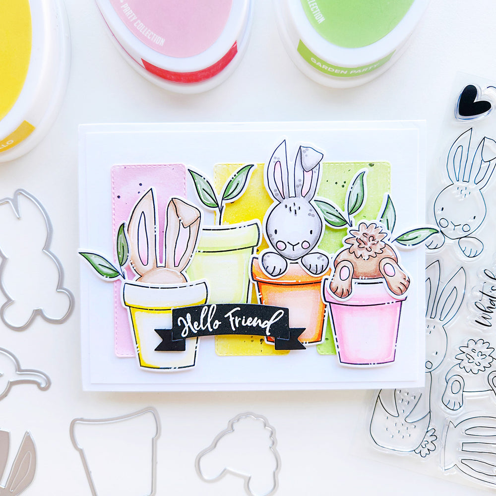 Celebrate spring with a charming Hello Friend card featuring bunnies in planters, vibrant yellow, pink, and green hues.