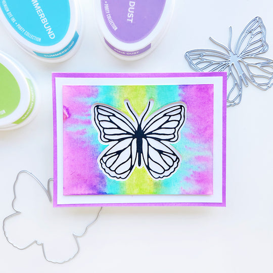 A beautiful butterfly on a watercolor background featuring purple, blue, and green hues, capturing the essence of spring and summer.