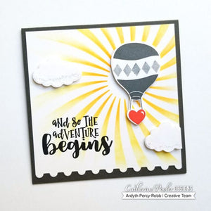 card with hot air balloon over twisted sunburst