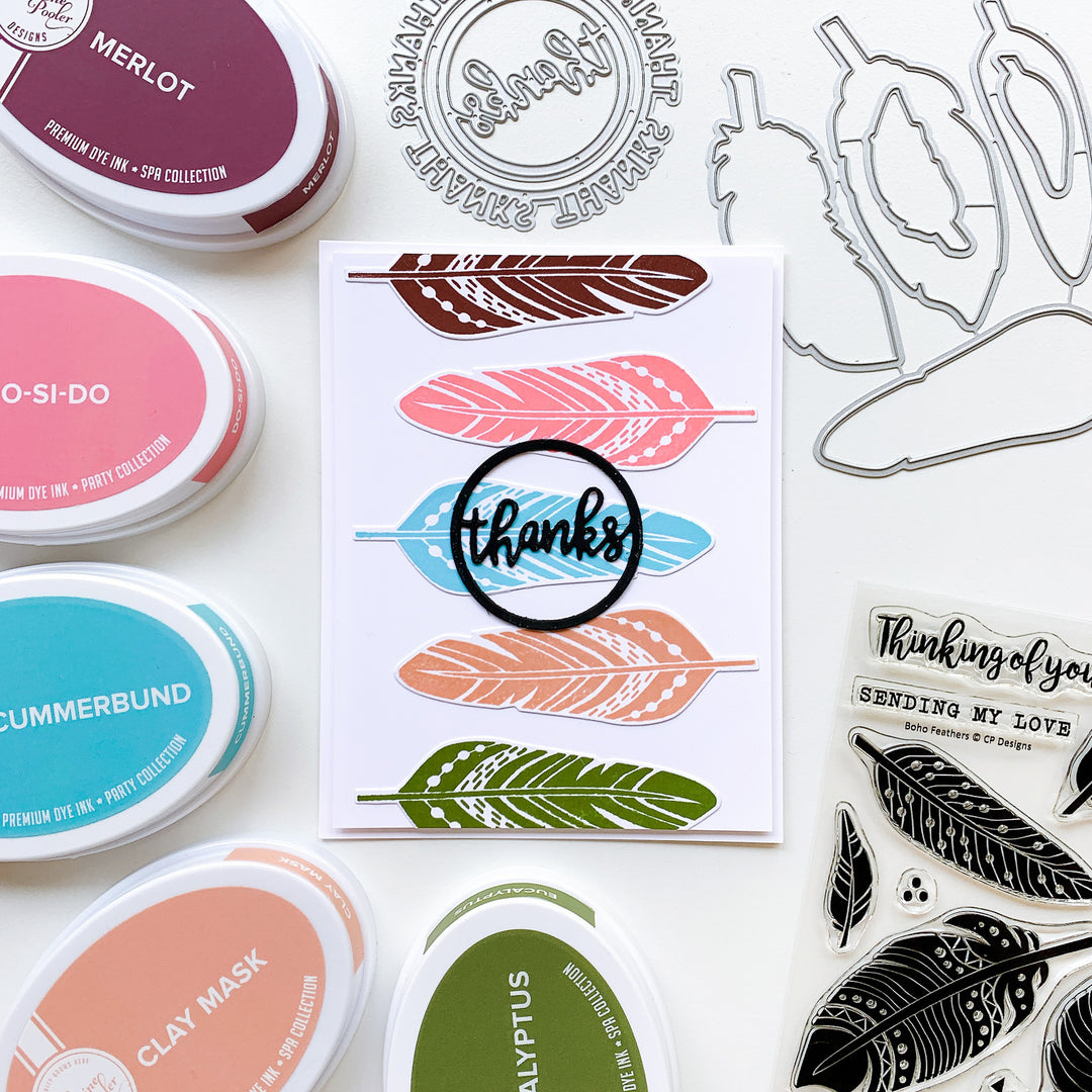 Stacked feathers with round of thanks card
