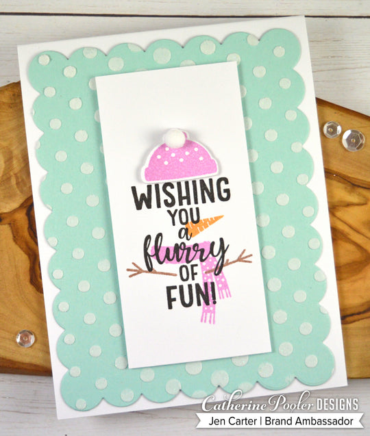 Wishing you a flurry of fun sentiment with snowman accessories on blue polka dot background