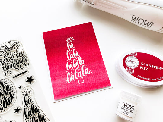 White embossed christmas tree on cranberry fizz background