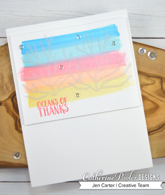 Coral dies with ocean of thanks sentiment on rainbow background