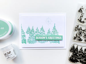 season's greetings card with evergreen woods stamp