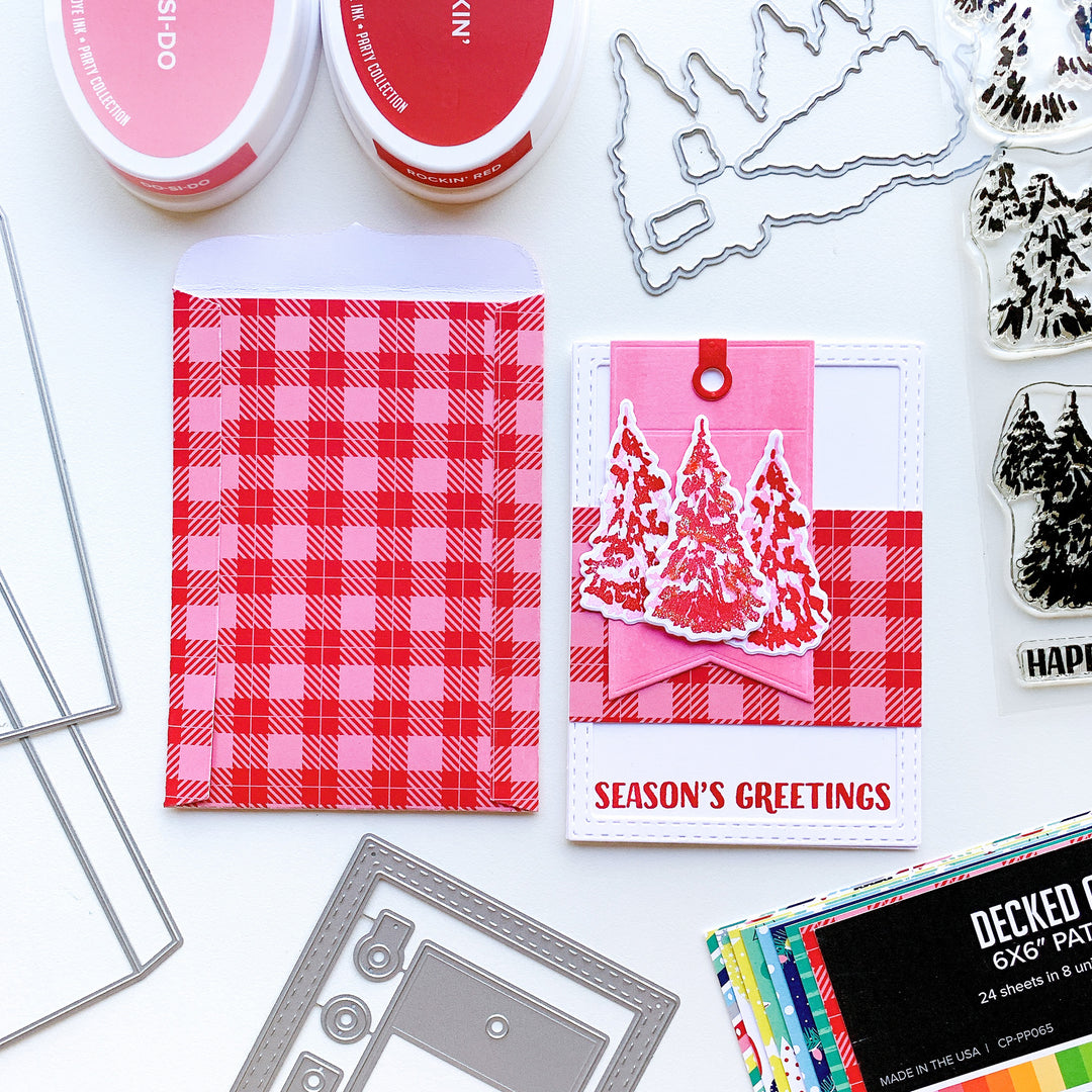 Season's greetings card with evergreen woods stamp