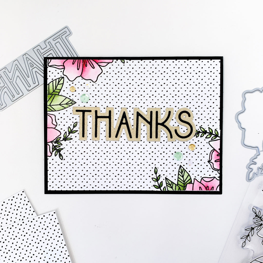 Deco Thanks on black polka dot background with flowers on edges