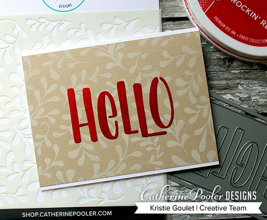 red hello on Kraft cardstock