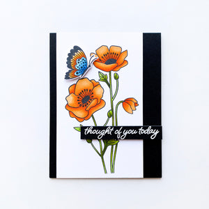 Orange flowers with blue and orange butterflies and black border