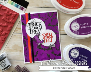 Purple and Black embossed bat background with witch boots and trick or treat sentiment
